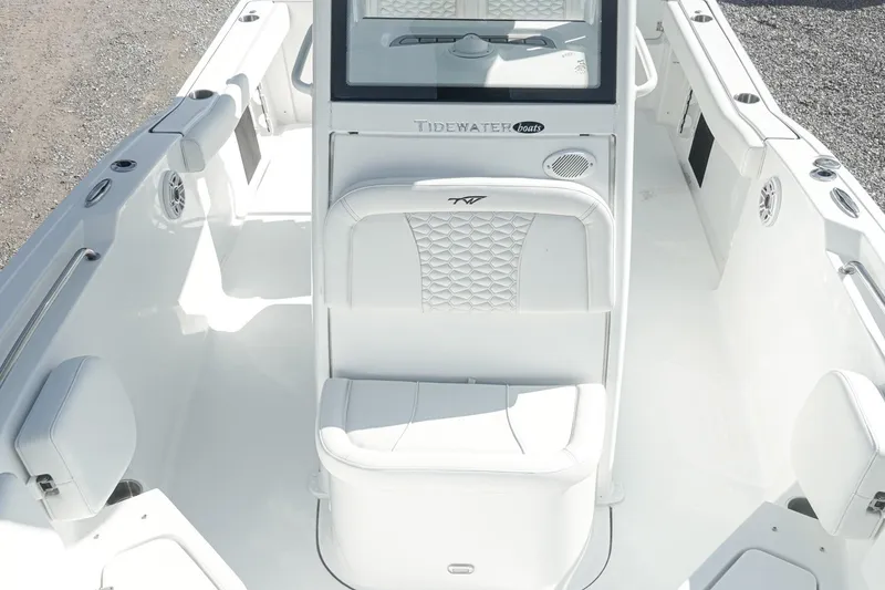 Slide: The Image of 2026 Tidewater 232 CC Adventure boat interior with white seating and modern design. - 15