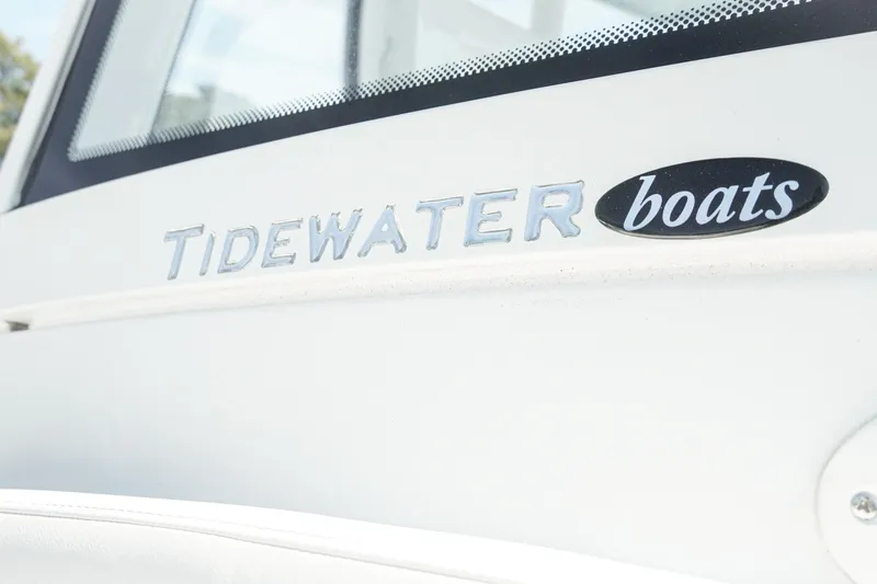 Slide: The Image of 2026 Tidewater 232 CC Adventure boat logo on white surface. - 26