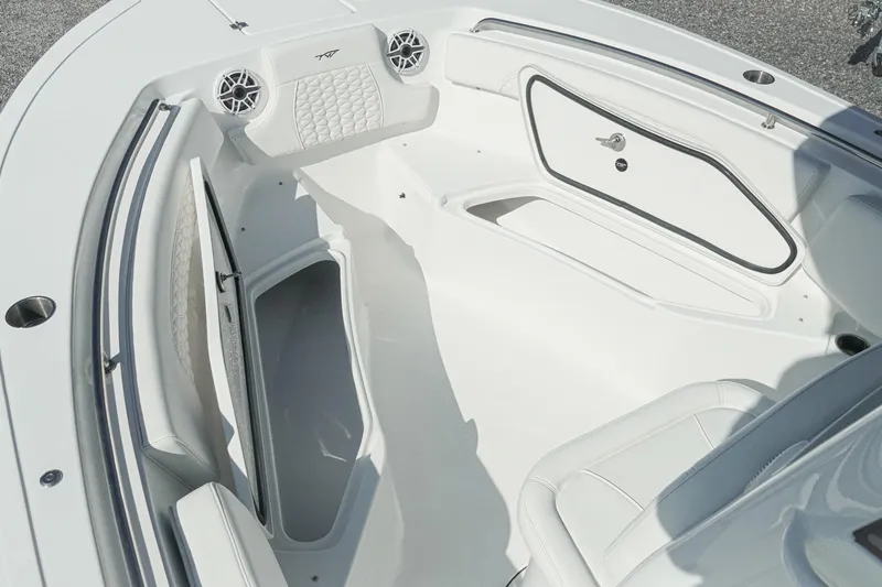 Slide: The Image of 2026 Tidewater 232 CC Adventure boat interior with storage compartments and seating. - 27