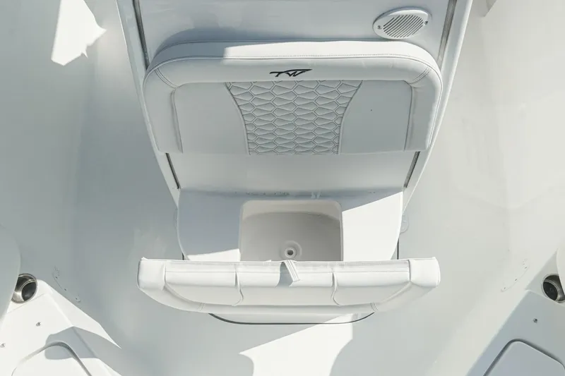 Slide: The Image of 2026 Tidewater 232 CC Adventure boat seat with storage compartment, white upholstery. - 29