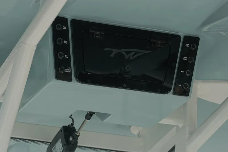 Slide: The Image of 2026 Tidewater 232 CC Adventure boat console with control panel and switches. - 36