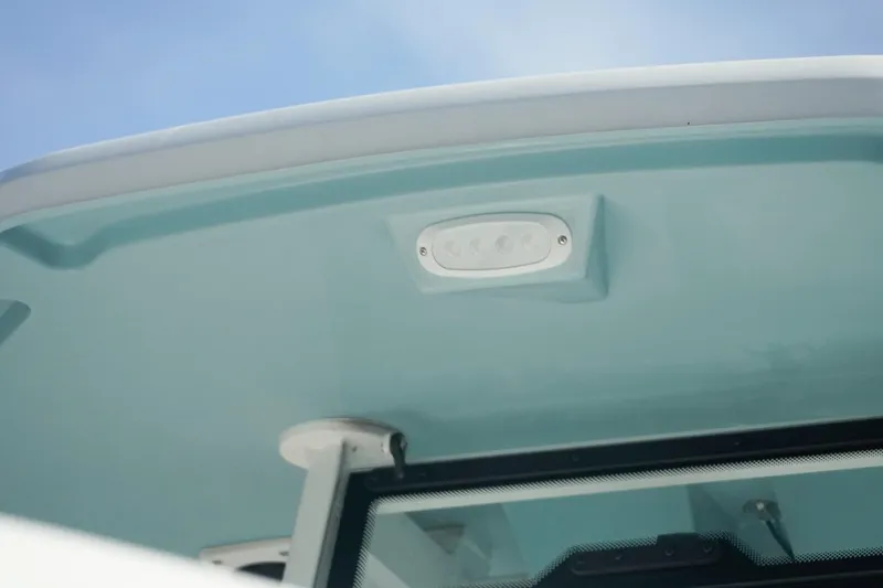 Slide: The Image of Tidewater 232 CC Adventure 2026 boat roof detail with light fixture. - 43