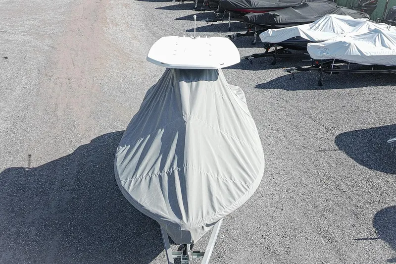 Slide: The Image of Covered 2026 Tidewater 232 CC Adventure boat on gravel lot. - 51