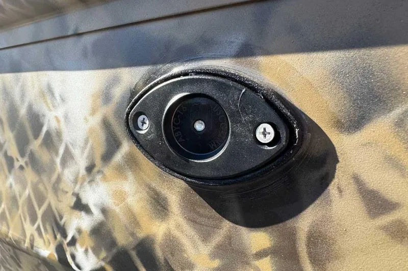 Slide: The Image of Close-up of a 2026 Excel Switchblade component with camouflage pattern. - 17