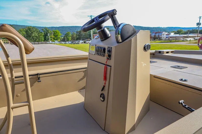 Slide: The Image of 2026 Excel Switchblade boat console with steering wheel, set against a scenic outdoor backdrop. - 6