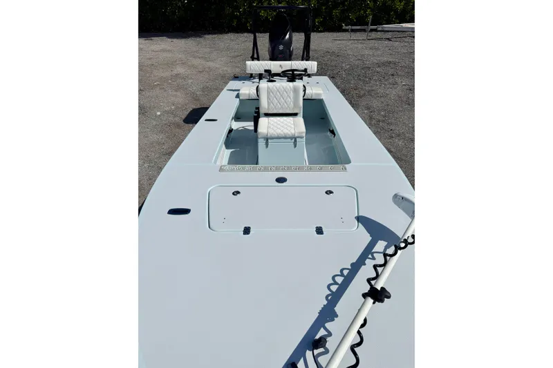 Slide: The Image of 2022 Beavertail Skiffs Vengeance 18 boat interior with seating and storage compartments. - 11