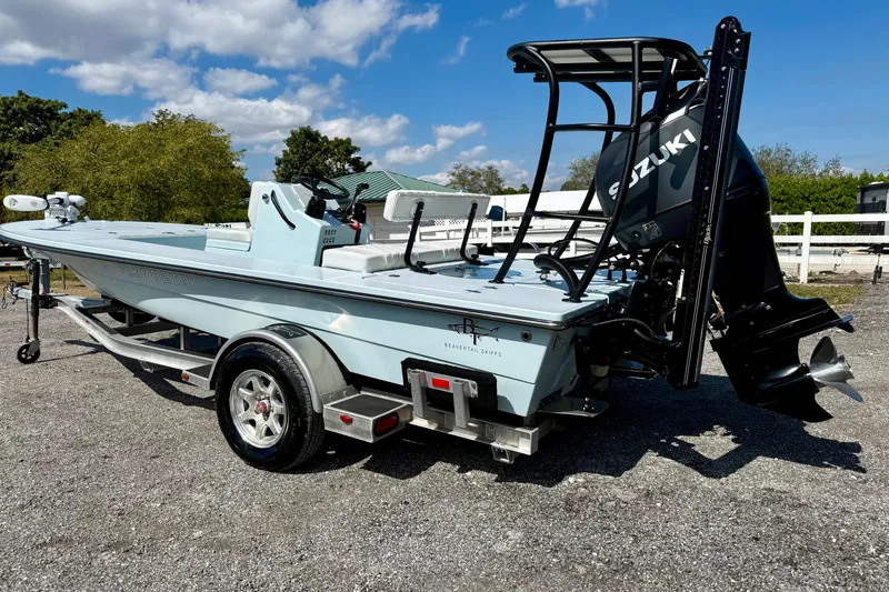 Slide: The Image of 2022 Beavertail Skiffs Vengeance 18 on trailer, featuring Suzuki outboard motor. - 27