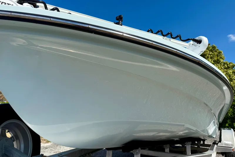 Slide: The Image of 2022 Beavertail Skiffs Vengeance 18 boat on trailer under clear blue sky. - 6