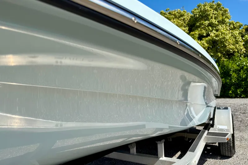 Slide: The Image of 2022 Beavertail Skiffs Vengeance 18 boat on trailer, side view, outdoors. - 7