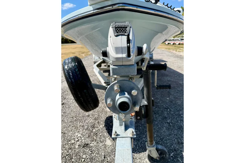 Slide: The Image of 2022 Beavertail Skiffs Vengeance 18 boat trailer close-up, showcasing hitch and wheel. - 9