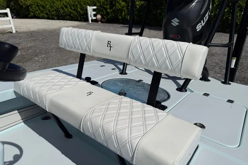 Slide: The Image of 2022 Beavertail Skiffs Vengeance 18 boat seating with diamond-stitched upholstery and Suzuki motor. - 14