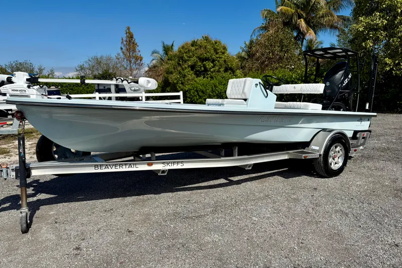 Slide: The Image of 2022 Beavertail Skiffs Vengeance 18 on trailer, parked outdoors with lush greenery. - 3