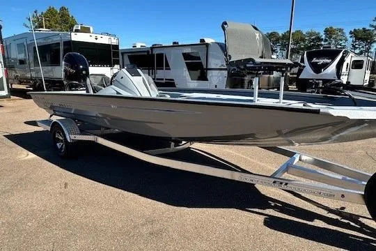 The Image of 2026 Express H20C boat on trailer, parked near RVs and trees. - 0