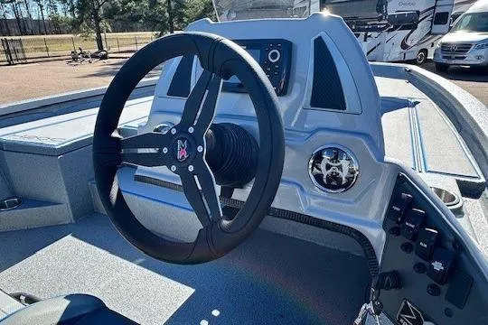 Slide: The Image of 2026 Express H20C boat dashboard with steering wheel and control panel. - 3