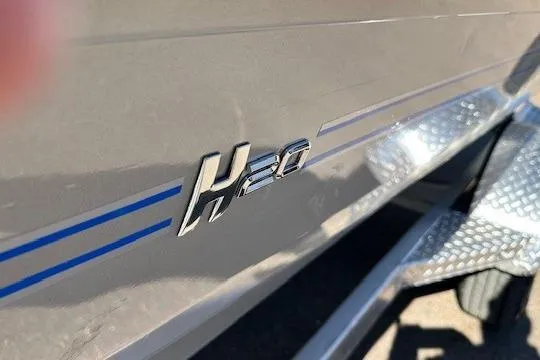 Slide: The Image of 2026 Express H20C boat with blue stripes and metallic detailing. - 6