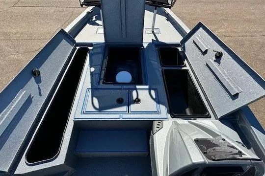 Slide: The Image of 2026 Express H20C boat interior with open storage compartments and sleek design. - 8