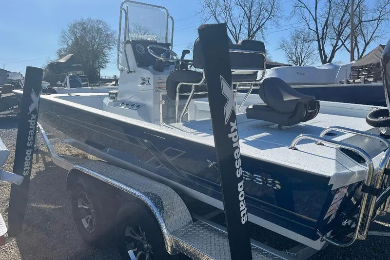 Slide: The Image of 2026 Xpress H22B Bay boat on trailer, featuring sleek design and modern console. - 8