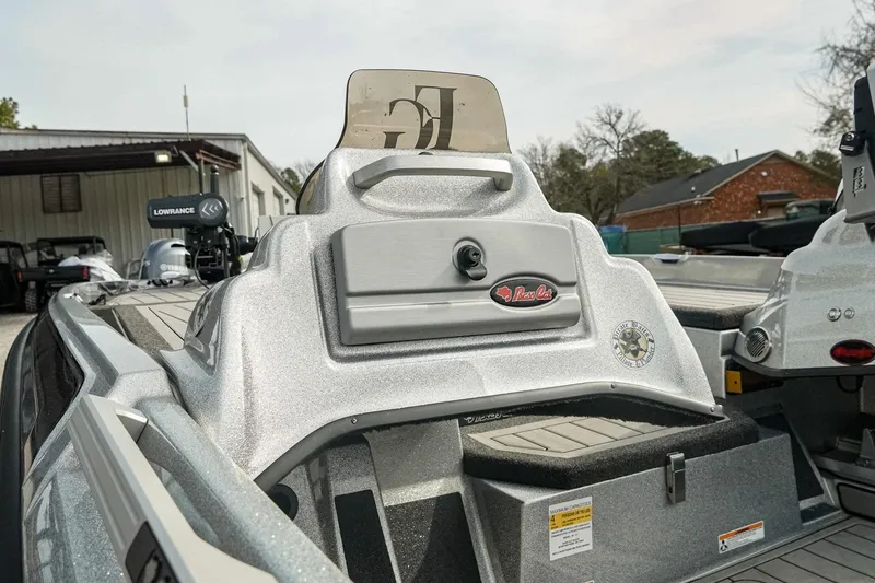 Slide: The Image of 2023 Bass Cat Puma STS boat interior with control panel and Lowrance equipment. - 12