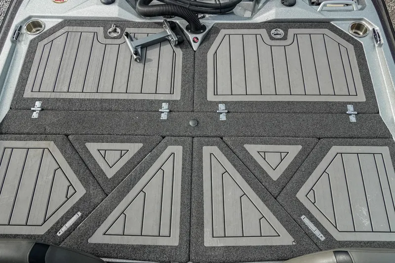 Slide: The Image of 2023 Bass Cat Puma STS boat deck with storage compartments and cup holders. - 15