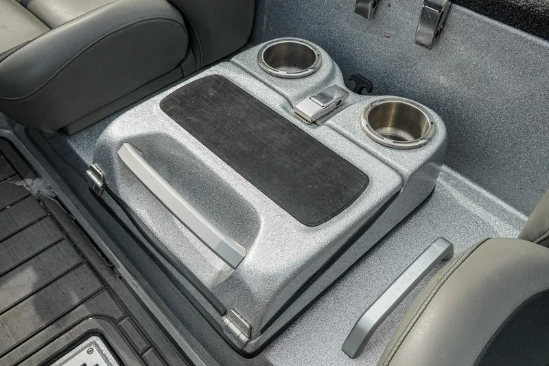 Slide: The Image of 2023 Bass Cat Puma STS interior with cup holders and storage compartment. - 29