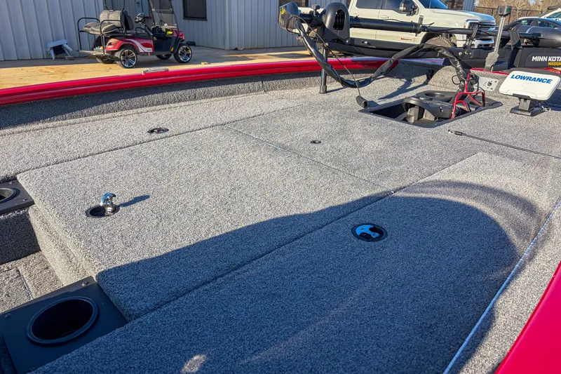 Slide: The Image of 2024 Tracker Pro Team 175 TXW Tournament Edition boat deck with fishing equipment. - 9