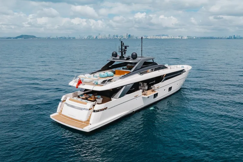 Slide: The Image of Luxurious 2020 Sanlorenzo SLA120A yacht cruising on open sea with city skyline backdrop. - 6