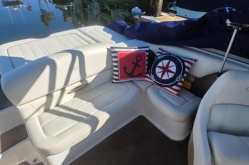 Slide: The Image of Luxurious 2008 Cobalt 212 boat interior with nautical-themed cushions and white leather seating. - 14