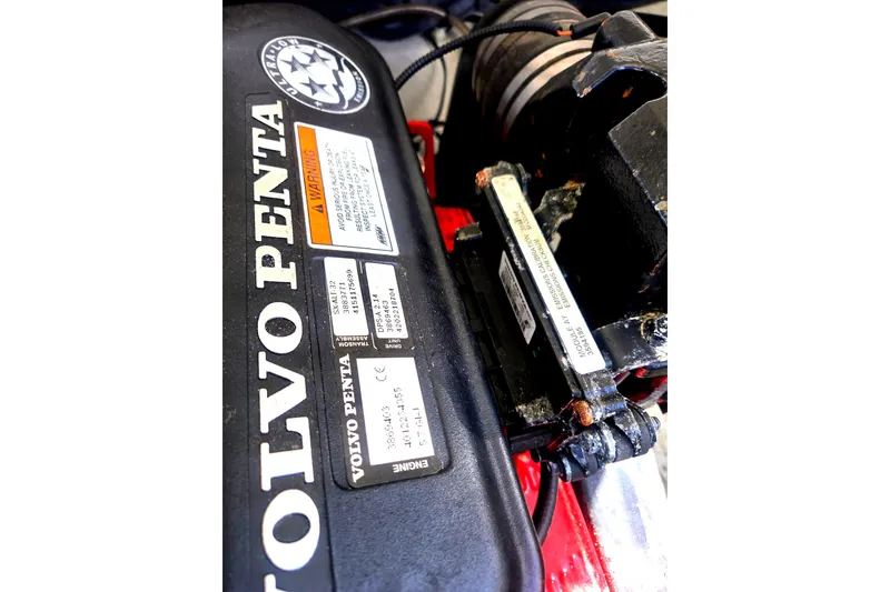 Slide: The Image of Volvo Penta engine in 2008 Cobalt 212 boat, featuring warning labels and serial numbers. - 19