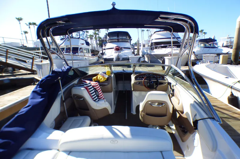 Slide: The Image of Interior view of a 2008 Cobalt 212 boat docked at a marina. - 2
