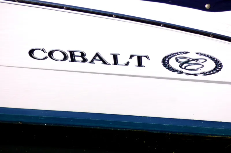 Slide: The Image of 2008 Cobalt 212 boat logo on white hull with emblem. - 22