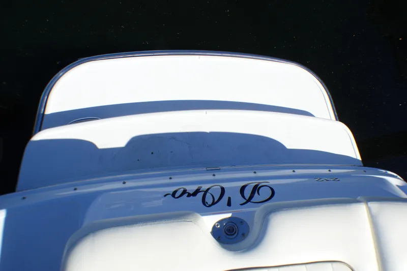 Slide: The Image of Rear view of a 2008 Cobalt 212 boat on water. - 25