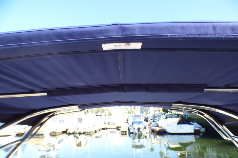 Slide: The Image of Blue canopy on a 2008 Cobalt 212 boat, docked at a marina. - 27