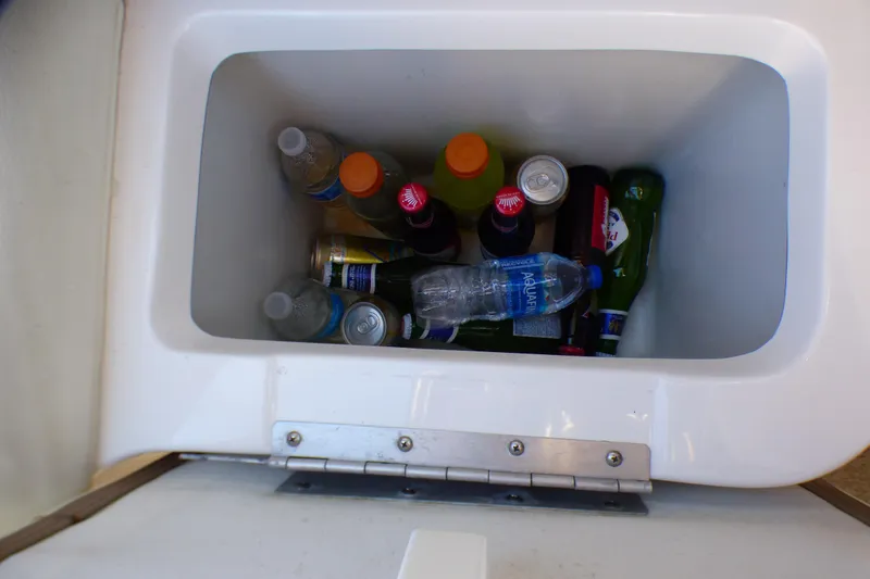 Slide: The Image of Cooler in 2008 Cobalt 212 boat filled with assorted drinks and bottles. - 32