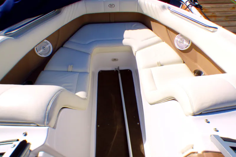 Slide: The Image of Interior of a 2008 Cobalt 212 boat with white and tan seating. - 7