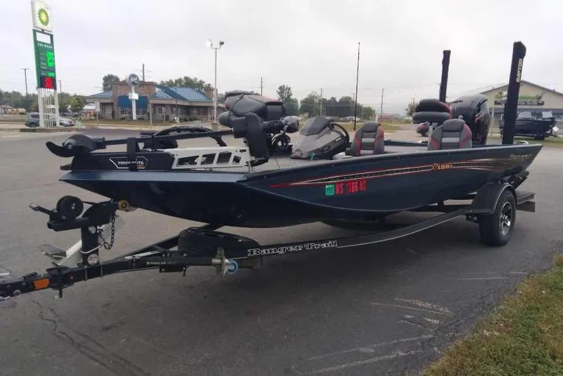 The Image of 2021 Ranger RT188P boat on trailer in parking lot, side view. - 1