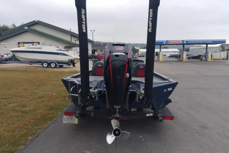 Slide: The Image of 2021 Ranger RT188P boat with Mercury engine at a marina parking lot. - 3