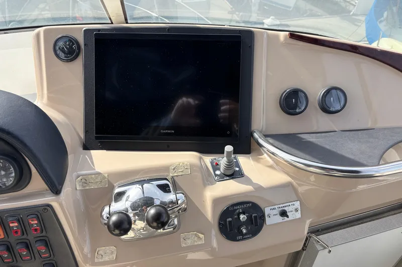 Slide: The Image of Control panel of a 2005 Carver 41 Cockpit Motor Yacht with Garmin display. - 14