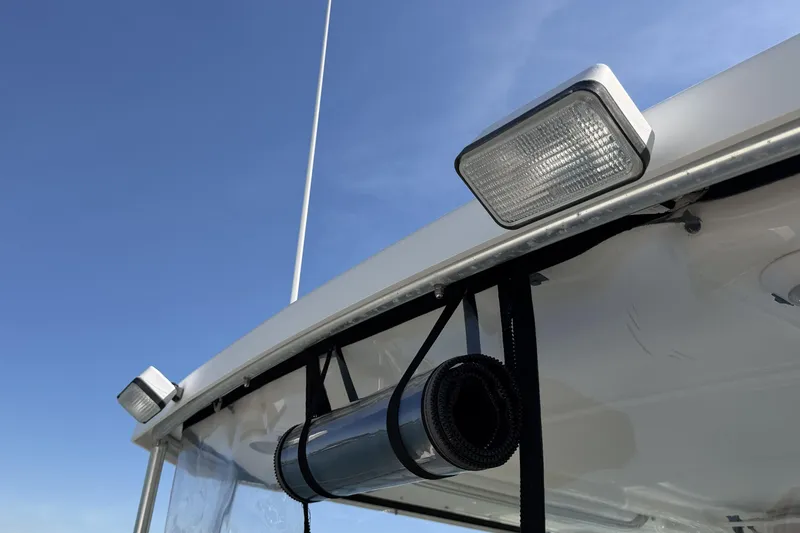 Slide: The Image of Close-up of 2003 Tiara 3100 Open boat's exterior lights and antenna against blue sky. - 10