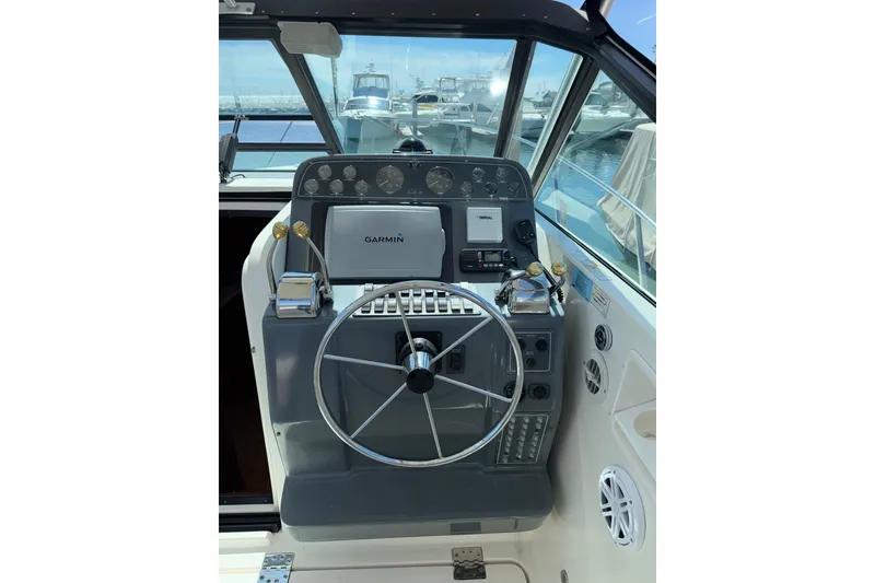 Slide: The Image of Helm of 2003 Tiara 3100 Open boat with Garmin navigation system. - 16