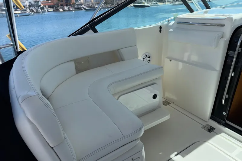 Slide: The Image of Luxurious seating area on a 2003 Tiara 3100 Open yacht, overlooking a marina. - 3