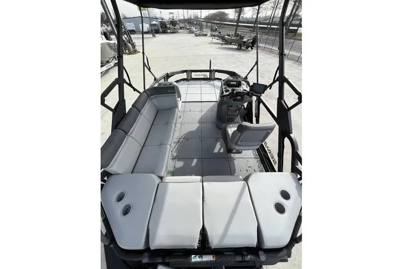 Slide: The Image of 2022 Sea Doo Switch 18 pontoon boat interior with seating and helm. - 15