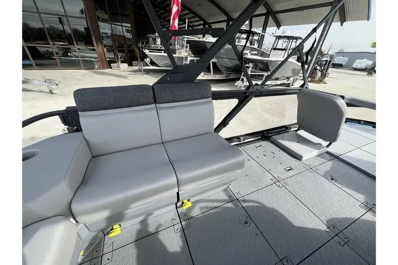 Slide: The Image of 2022 Sea Doo Switch 18 interior with gray seating and modern design. - 22