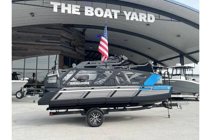 Slide: The Image of 2022 Sea Doo Switch 18 pontoon boat displayed at The Boat Yard dealership. - 6