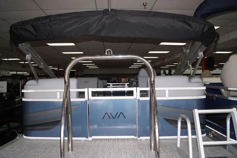 Slide: The Image of 2026 Avalon VLS Quad Lounge 21' pontoon boat with sleek design in showroom. - 14