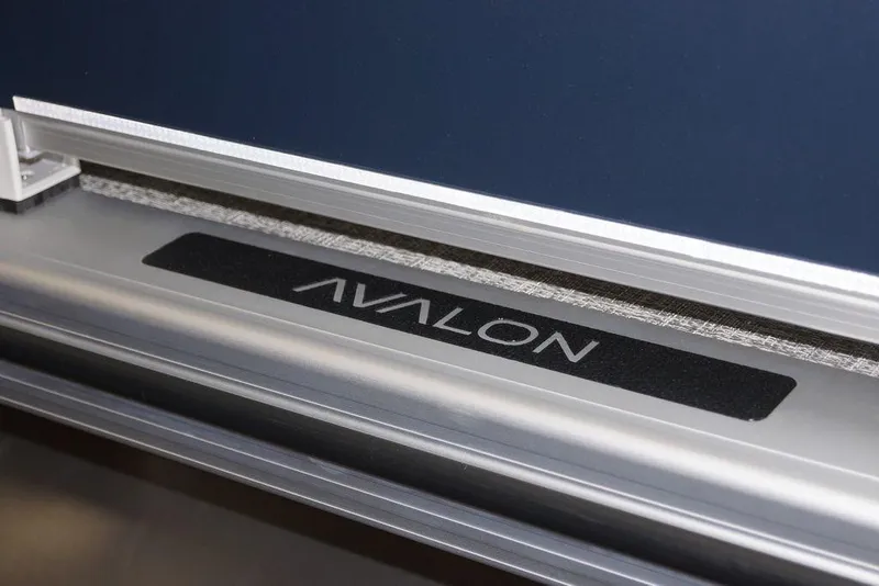 Slide: The Image of 2026 Avalon VLS Quad Lounge 21' logo on sleek metallic surface. - 17