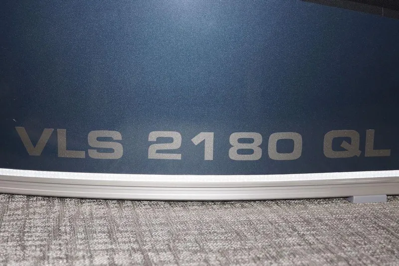 Slide: The Image of Close-up of Avalon VLS Quad Lounge 21' 2026 model, featuring VLS 2180 QL branding. - 18