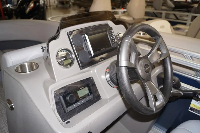 Slide: The Image of Steering console of 2026 Avalon VLS Quad Lounge 21' boat with modern controls. - 7