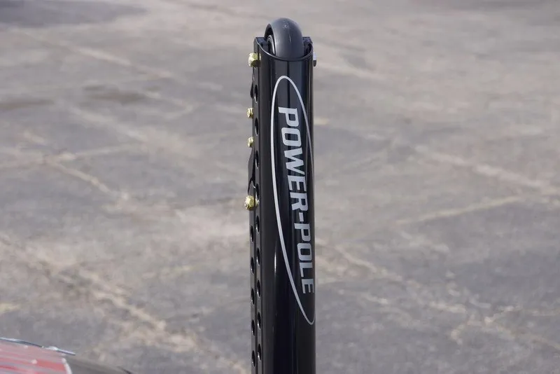 Slide: The Image of Power-Pole anchor on 2026 Phoenix 21 XE boat, outdoor setting. - 10