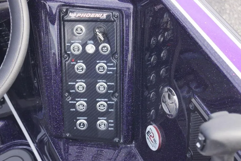 Slide: The Image of Control panel of a 2026 Phoenix 21 XE boat with various switches and buttons. - 11