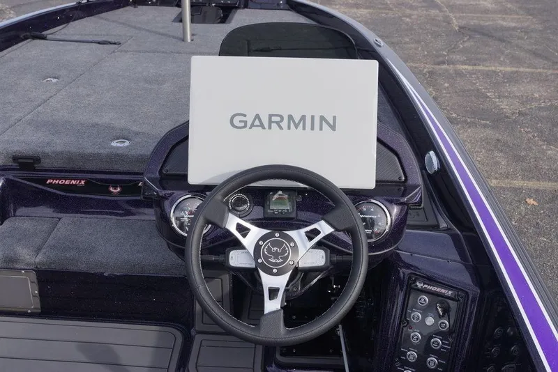 Slide: The Image of Steering console of 2026 Phoenix 21 XE boat with Garmin display. - 12